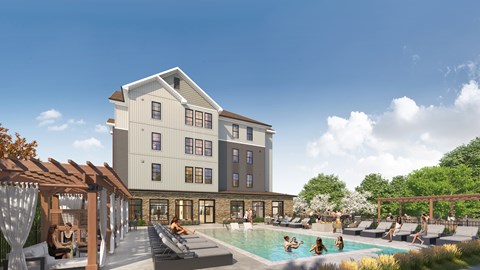 A large building with a pool in front of it.